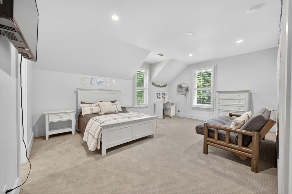 4275 Habersham Way Cumming, GA 30041 - Photo 21 of 34 a spacious bedroom with bed and a couch