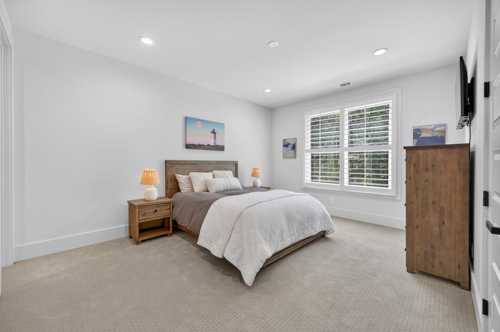 4275 Habersham Way Cumming, GA 30041 - Photo 23 of 34 a bed room with a bed and a wall painting