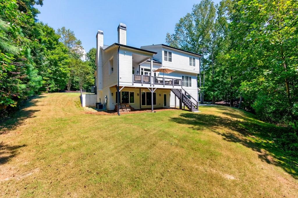 4275 Habersham Way Cumming, GA 30041 - Photo 29 of 34 a front view of a house with a yard
