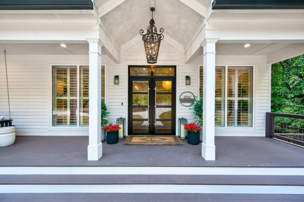 4275 Habersham Way Cumming, GA 30041 - Photo 3 of 34 a front view of a house with a large window