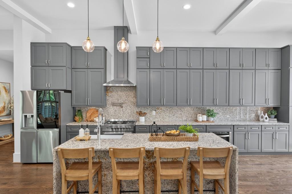 4275 Habersham Way Cumming, GA 30041 - Photo 7 of 34 a kitchen with a dining table chairs and refrigerator
