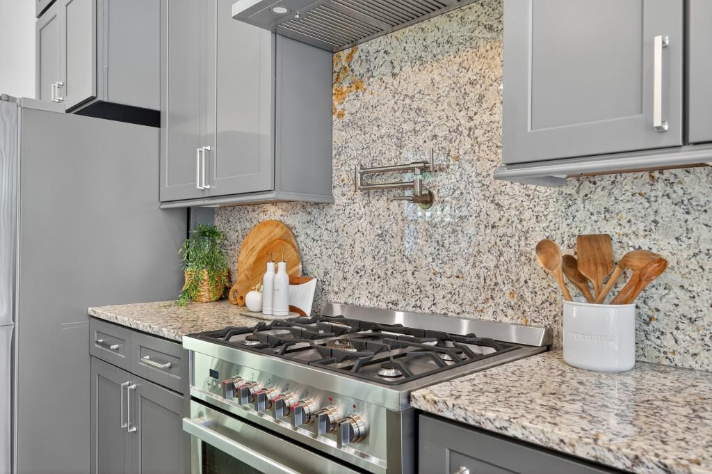 4275 Habersham Way Cumming, GA 30041 - Photo 8 of 34 a stove top oven sitting inside of a kitchen