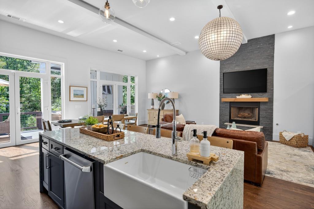 4275 Habersham Way Cumming, GA 30041 - Photo 10 of 34 a kitchen with granite countertop a sink and a stove