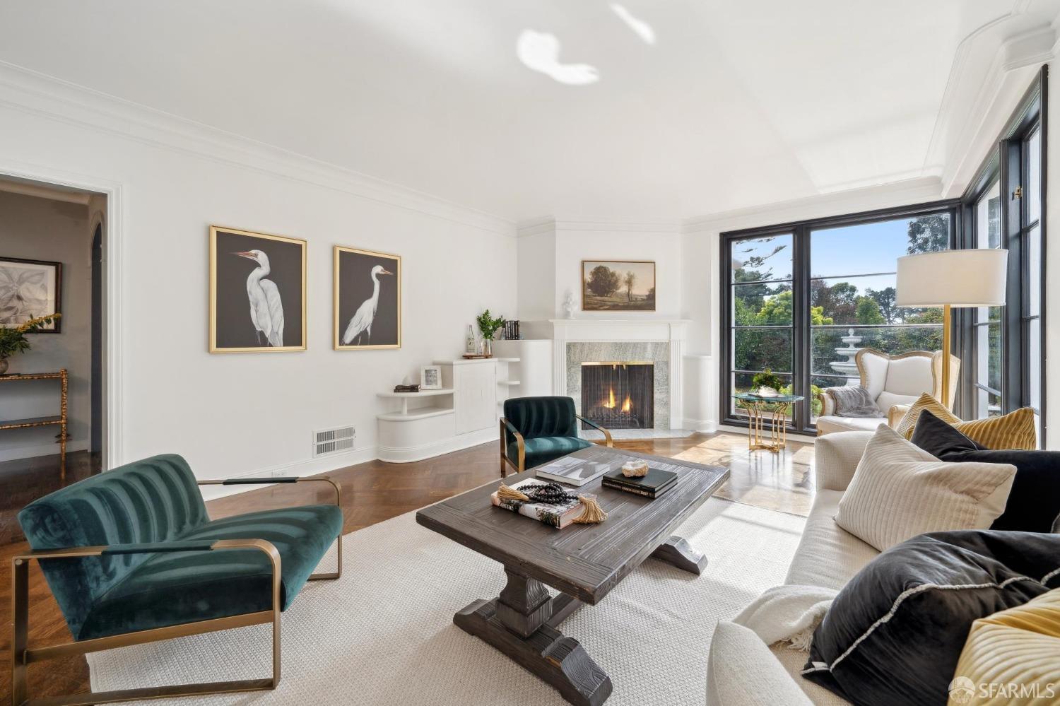 100 Stonecrest Drive San Francisco, CA 94132 - Photo 13 of 64 a living room with furniture a rug a fireplace and a large window