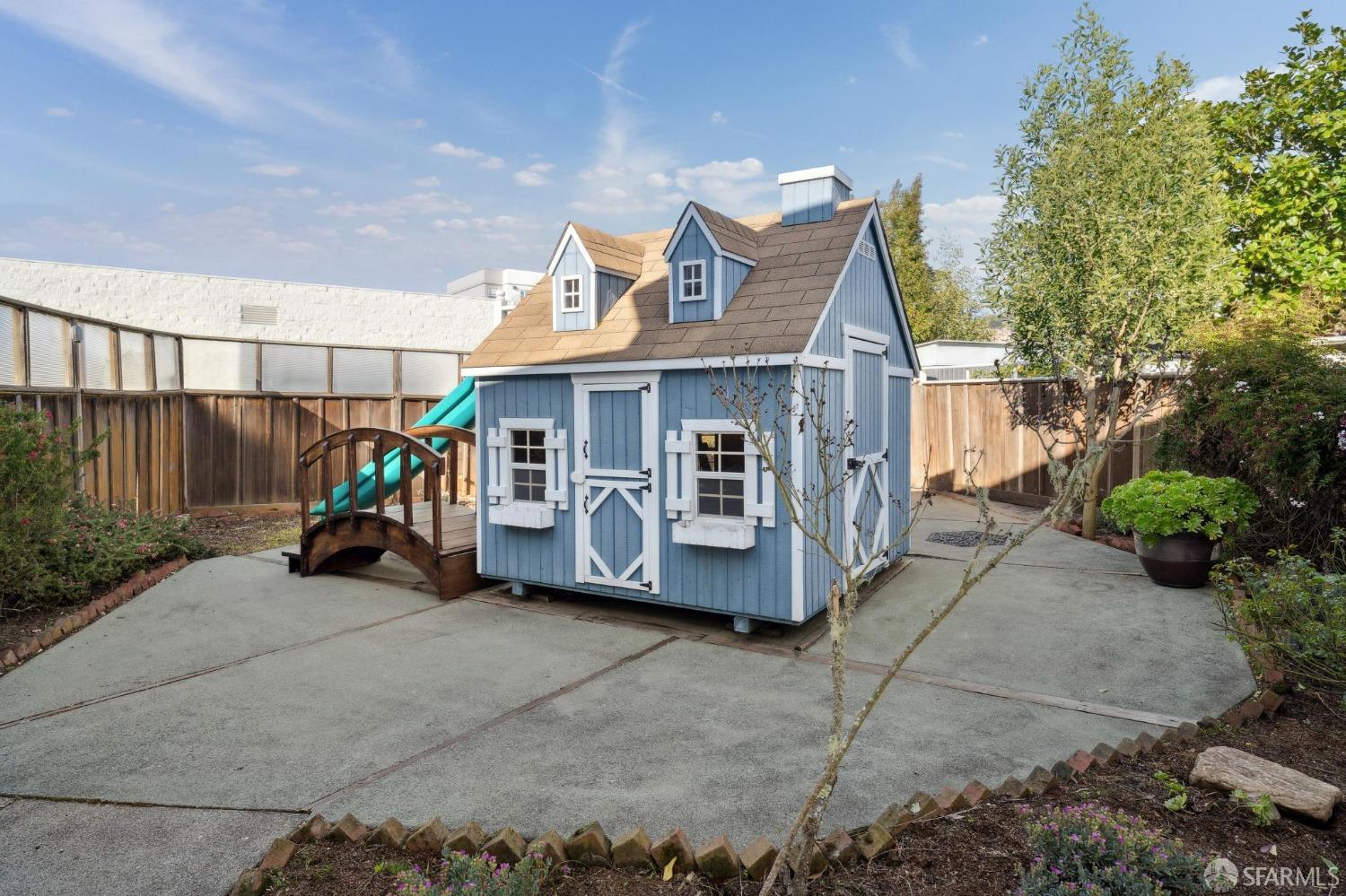 100 Stonecrest Drive San Francisco, CA 94132 - Photo 60 of 64 a view of a house with a patio and a yard