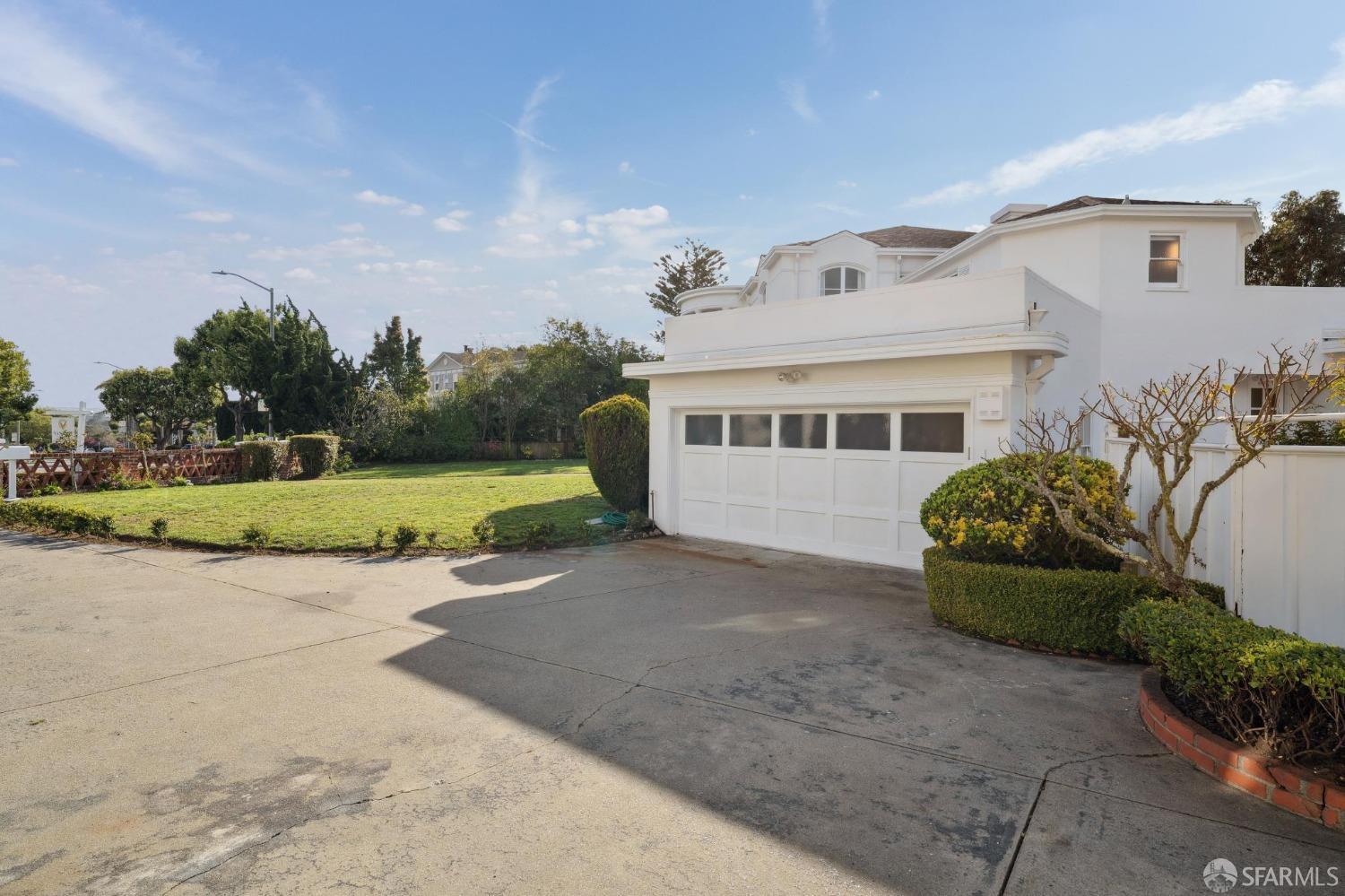 100 Stonecrest Drive San Francisco, CA 94132 - Photo 61 of 64 a front view of a house with a yard and garage