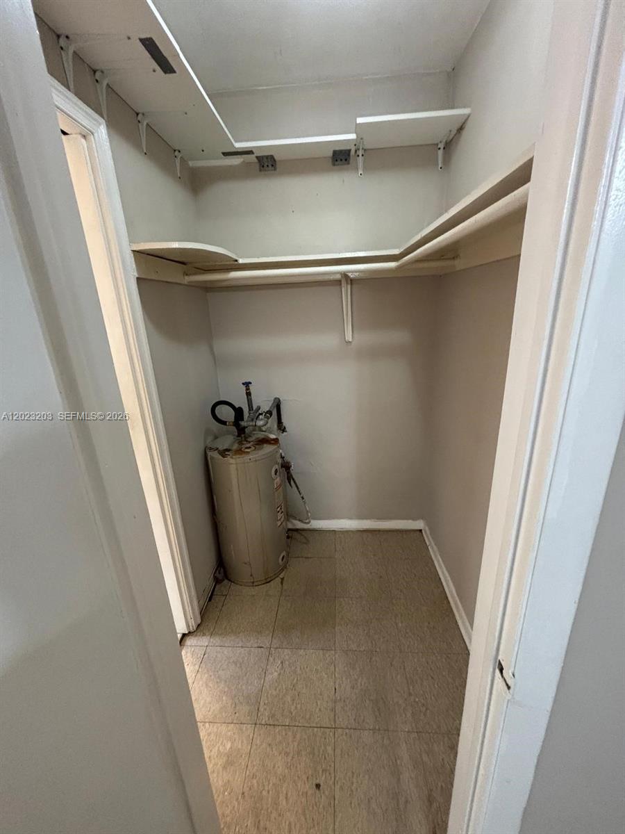 520 Southwest 4th Street, Unit 11 Miami, FL 33130 - Photo 5 of 7 a view of walk in closet with empty racks