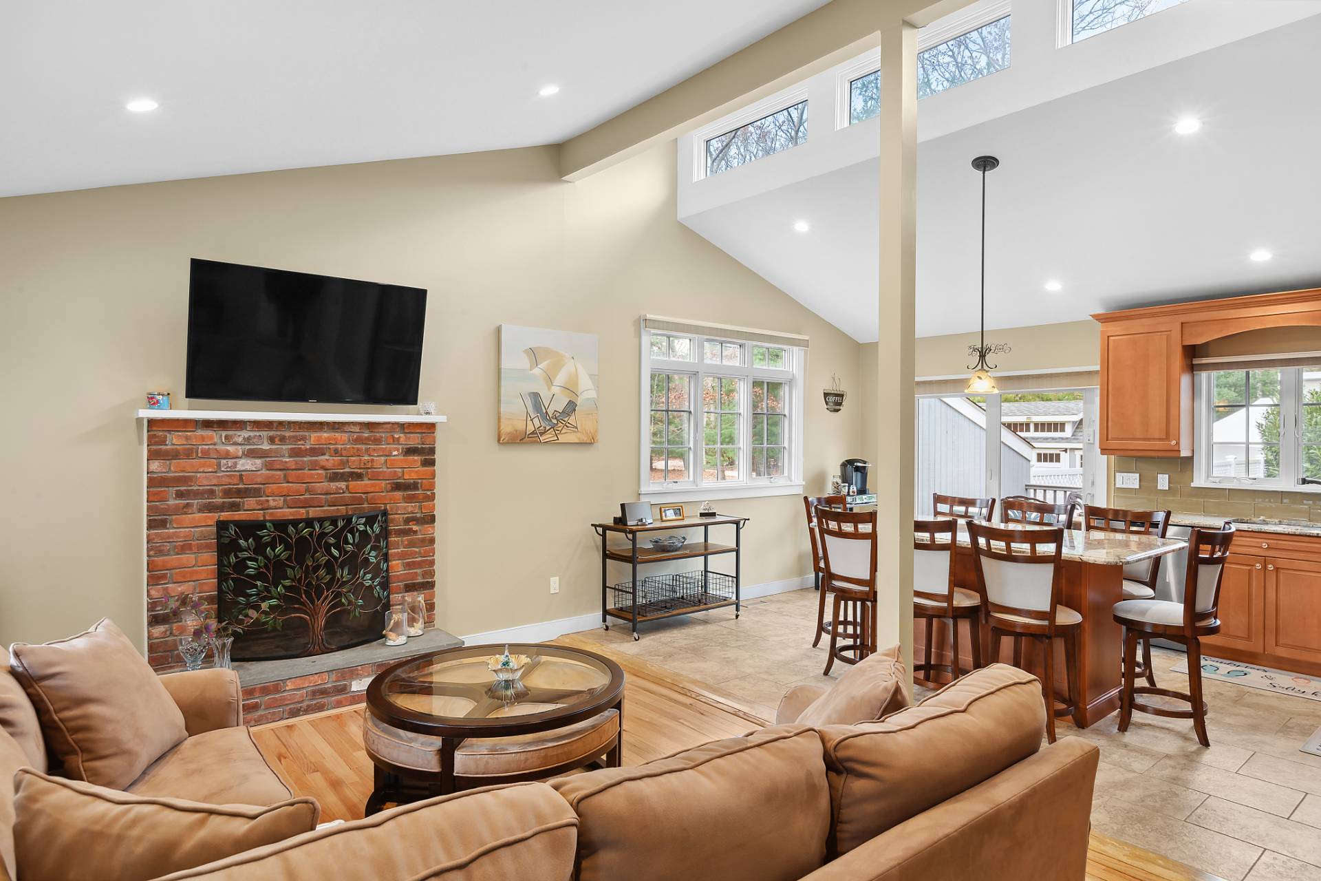 60 Cedar Drive East Hampton, NY 11937 - Photo 1 of 10 a living room with furniture a fireplace and a flat screen tv