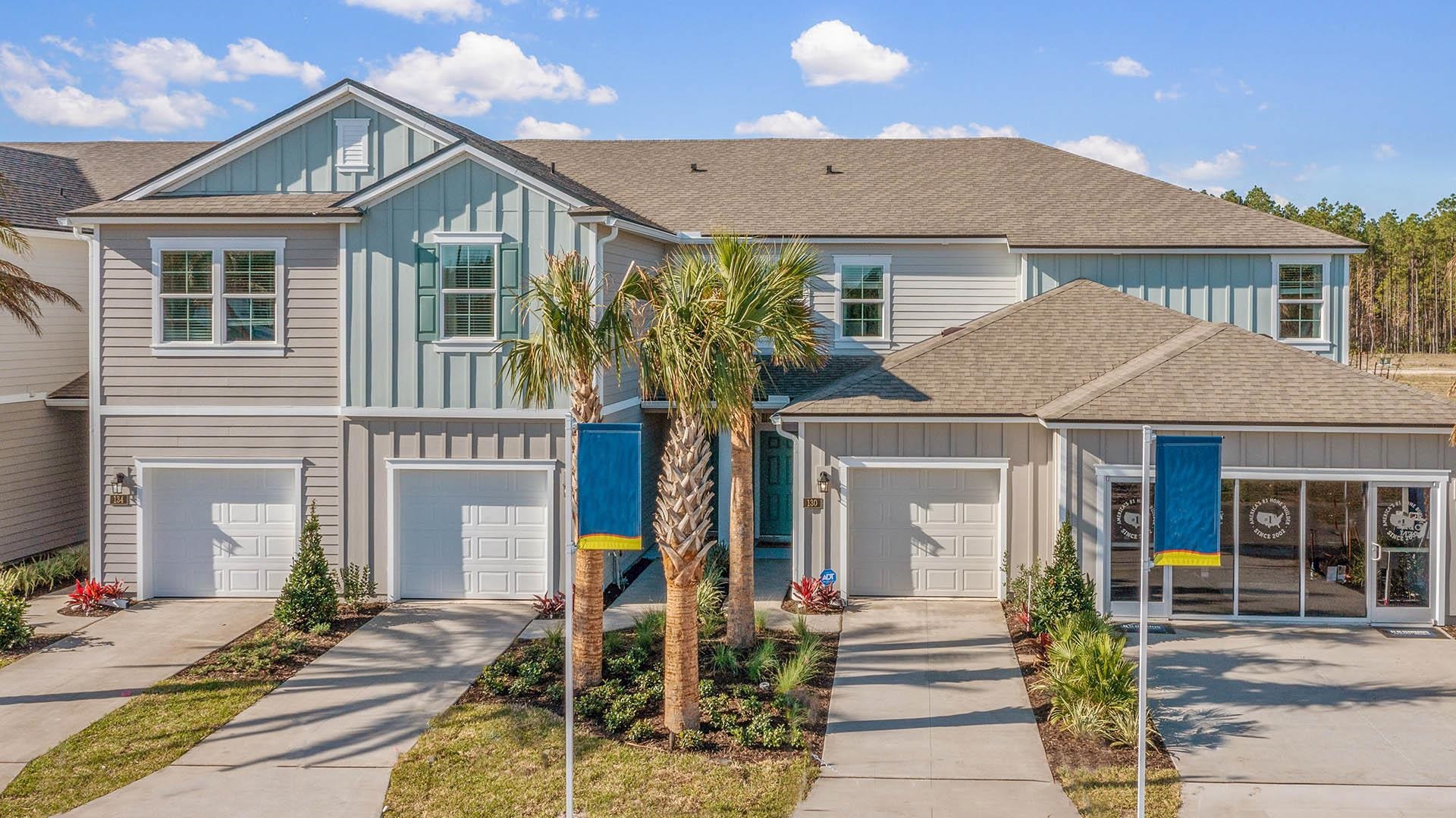 340 Redbud Road Palm Coast, FL 32137 - Photo 2 of 33 a front view of a house with garden