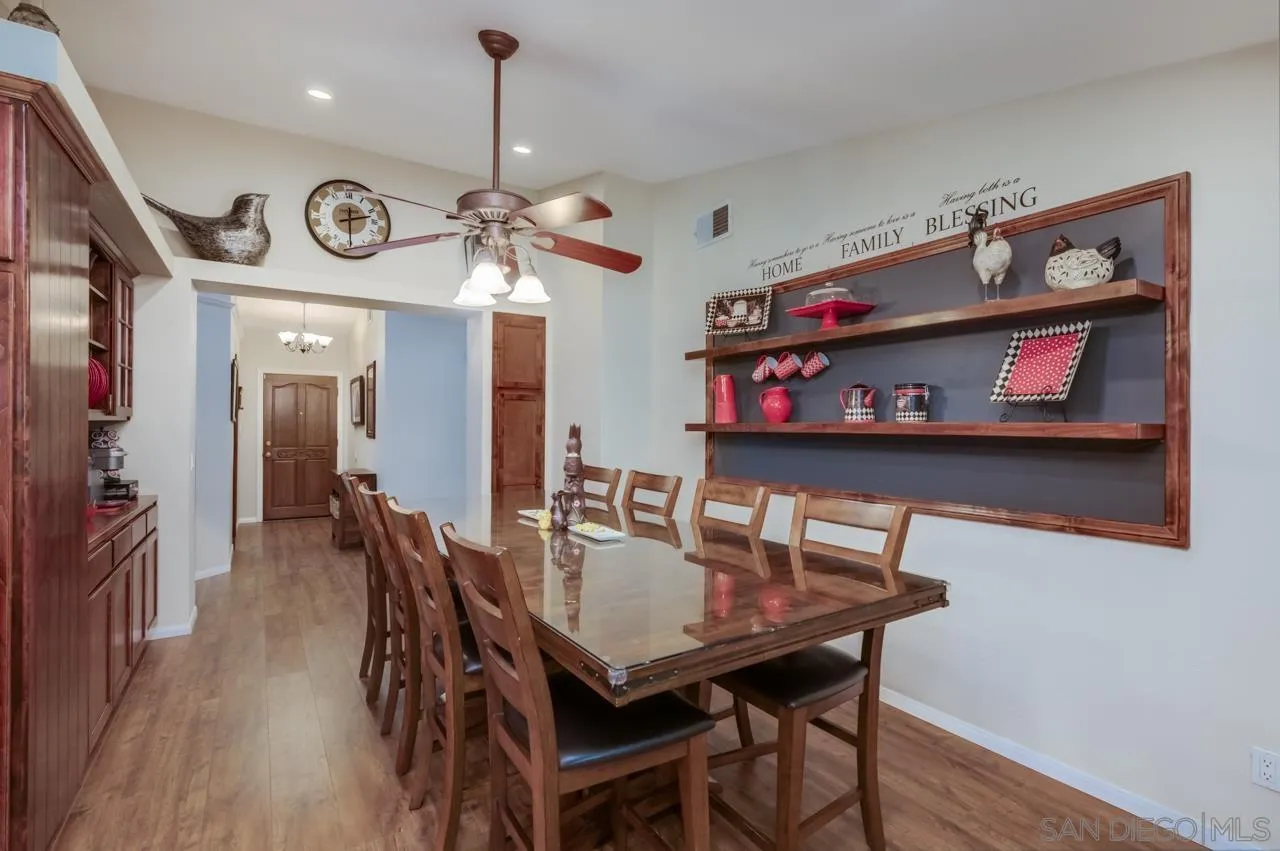 13499 Khuram Street Lakeside, CA 92040 - Photo 12 of 50 a view of a dining room with furniture and wooden floor