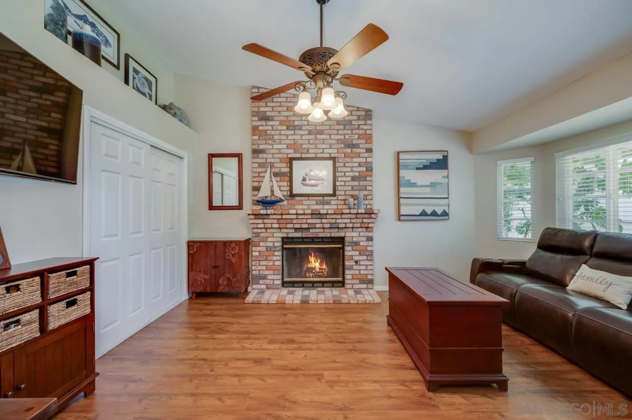 13499 Khuram Street Lakeside, CA 92040 - Photo 14 of 50 a living room with furniture a fireplace and a window