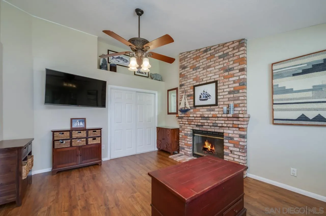 13499 Khuram Street Lakeside, CA 92040 - Photo 16 of 50 a view of a livingroom with furniture and a flat screen tv