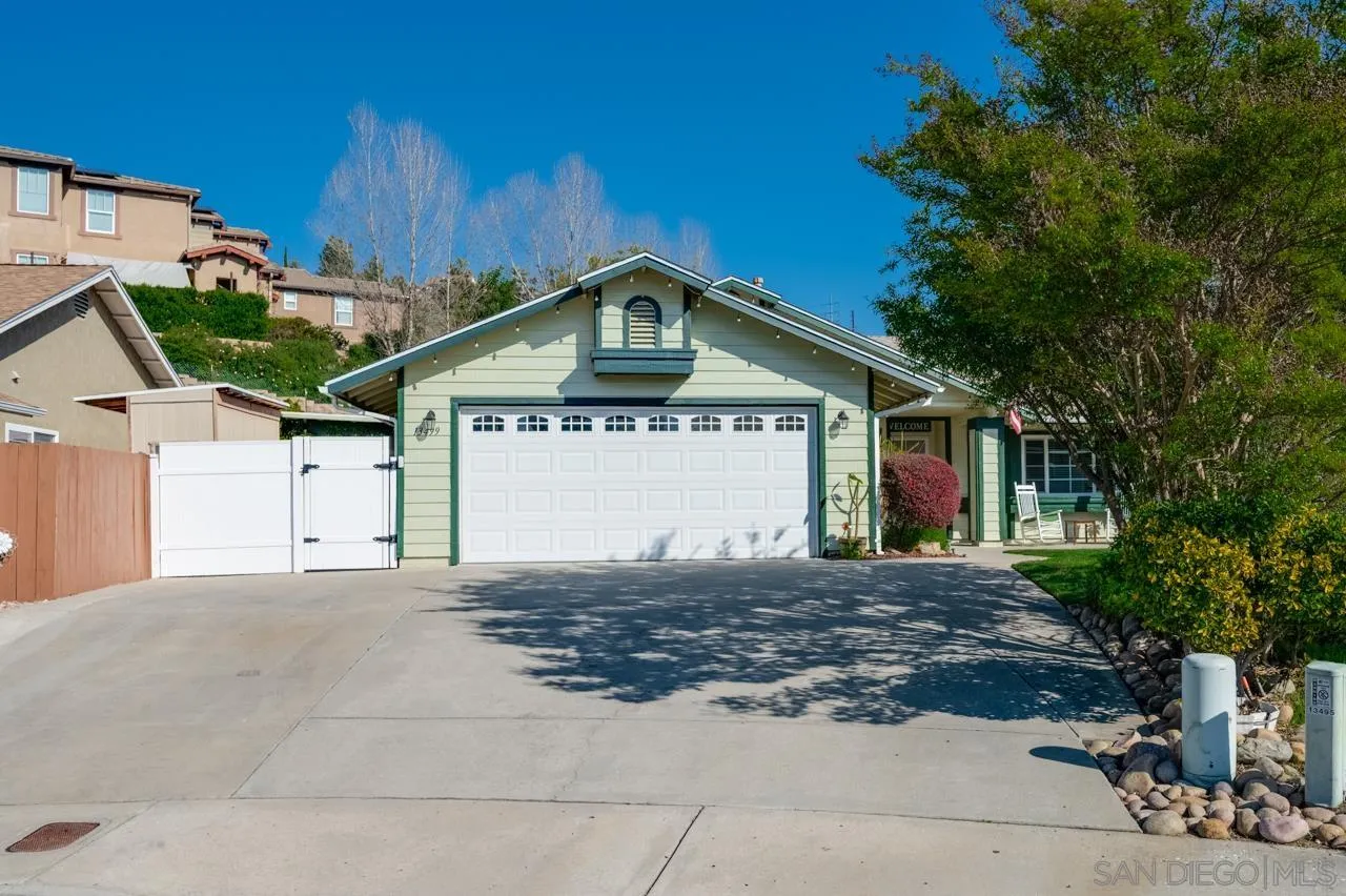 13499 Khuram Street Lakeside, CA 92040 - Photo 2 of 50 a front view of a house with a yard
