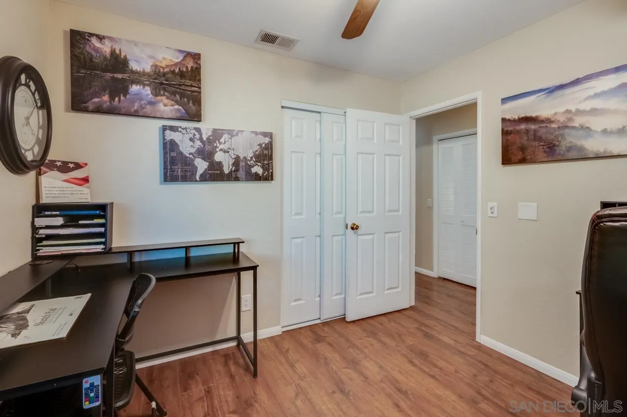 13499 Khuram Street Lakeside, CA 92040 - Photo 21 of 50 a view of a hallway with wooden floor and workspace