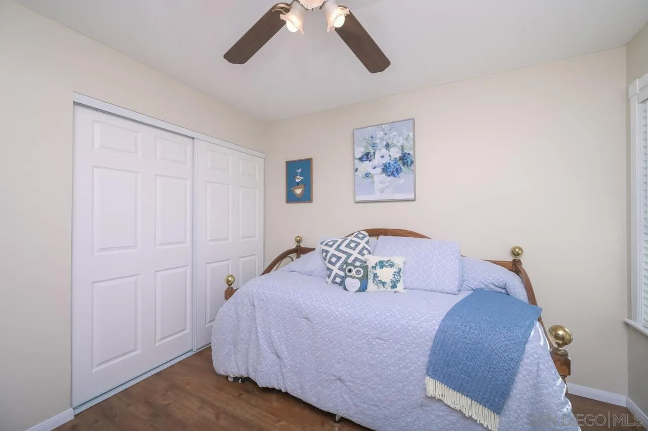 13499 Khuram Street Lakeside, CA 92040 - Photo 23 of 50 a bedroom with a bed and a painting on the wall