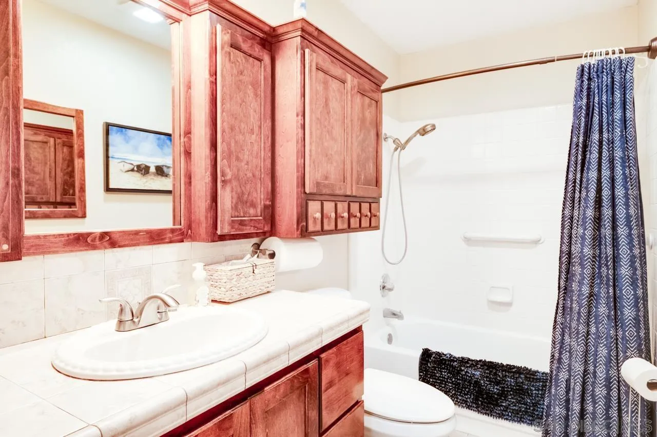 13499 Khuram Street Lakeside, CA 92040 - Photo 25 of 50 a bathroom with a sink toilet and shower