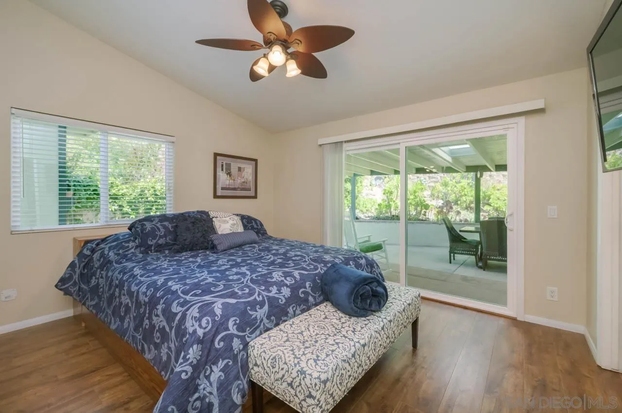 13499 Khuram Street Lakeside, CA 92040 - Photo 26 of 50 a bedroom with a large bed and a window