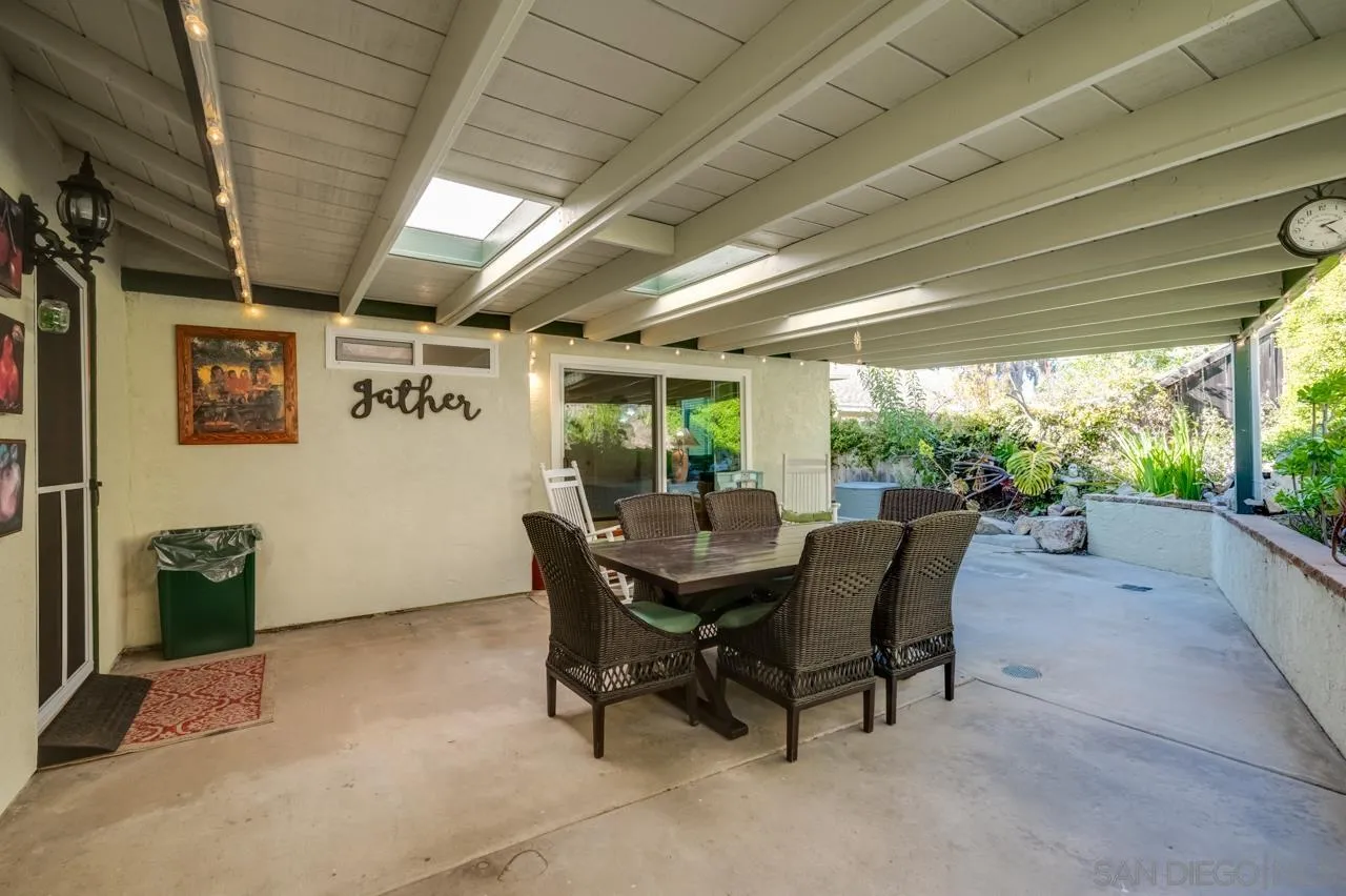 13499 Khuram Street Lakeside, CA 92040 - Photo 31 of 50 a dining room with furniture and a garden