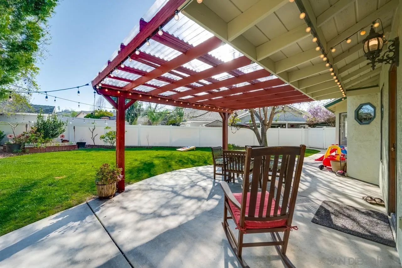 13499 Khuram Street Lakeside, CA 92040 - Photo 34 of 50 a view of a patio with a table chairs and a yard