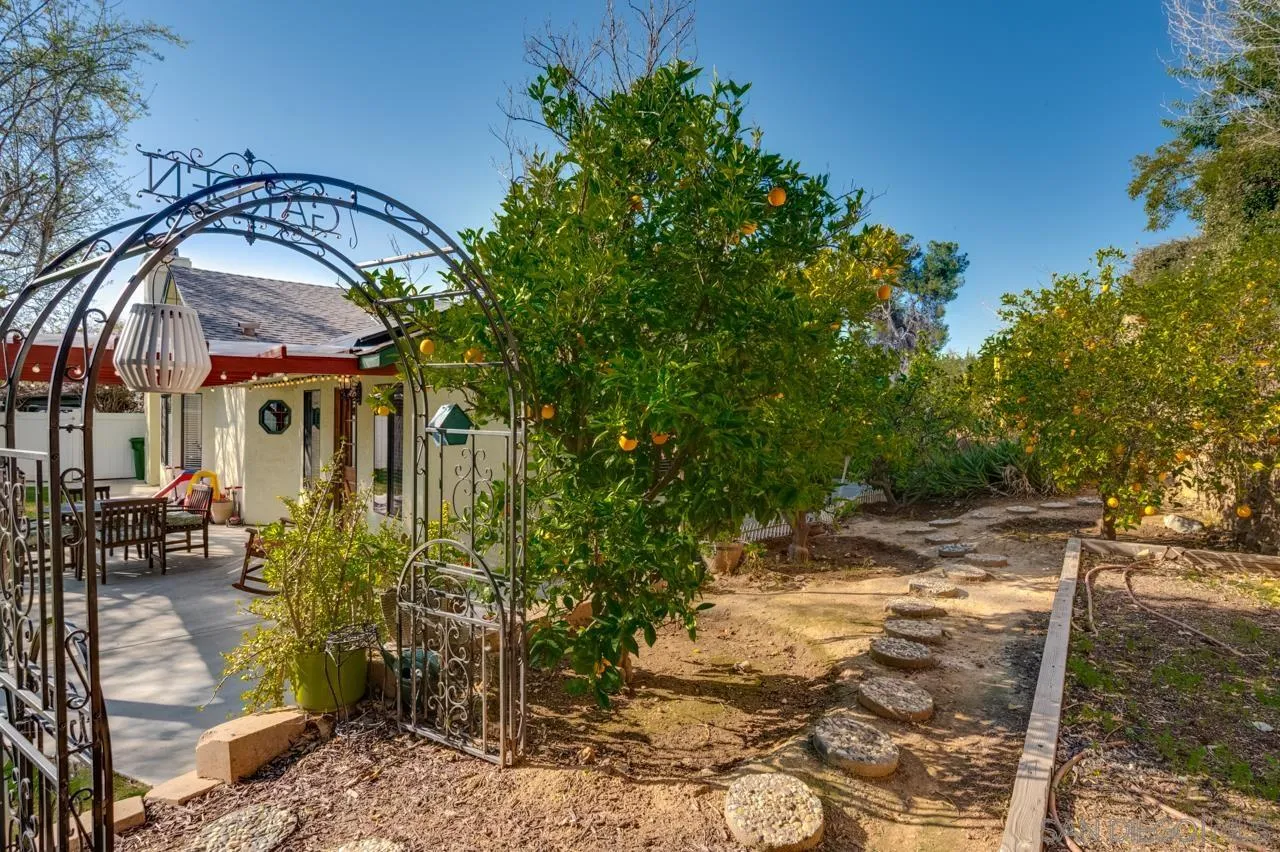 13499 Khuram Street Lakeside, CA 92040 - Photo 39 of 50 a patio with table and chairs and potted plants