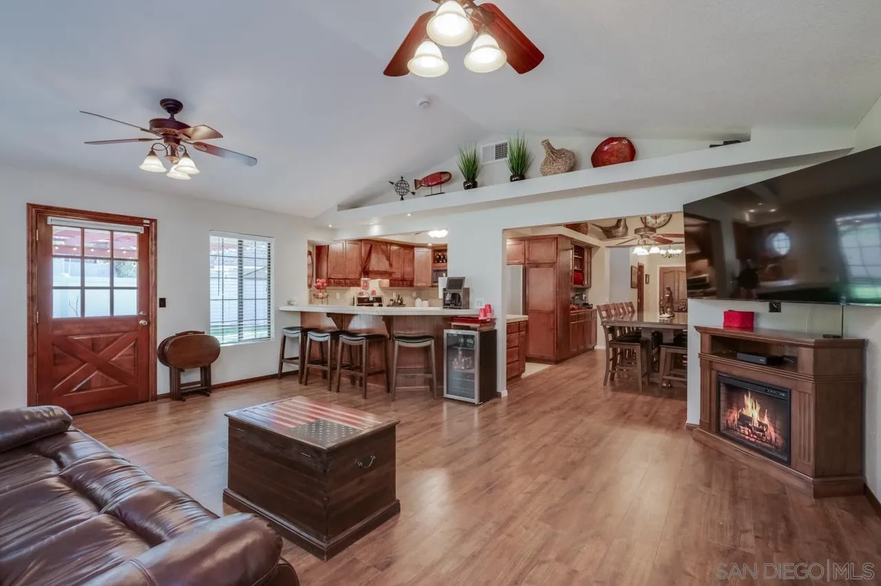13499 Khuram Street Lakeside, CA 92040 - Photo 6 of 50 a living room with furniture and a flat screen tv