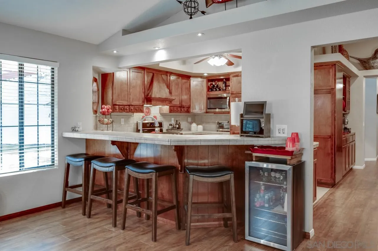 13499 Khuram Street Lakeside, CA 92040 - Photo 7 of 50 a kitchen with a sink cabinets and window