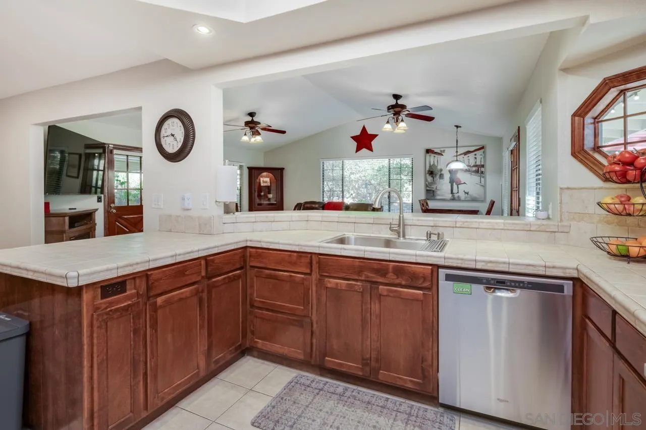 13499 Khuram Street Lakeside, CA 92040 - Photo 10 of 50 a kitchen with cabinets and window