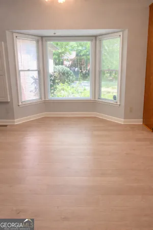 a view of a dining room with furniture window and outside view