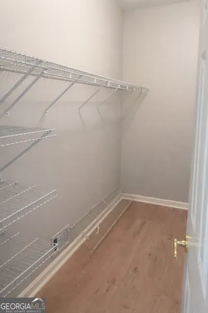 a bath tub sitting in a bathroom next to a window