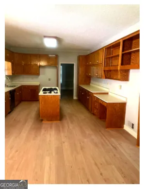 a kitchen with stainless steel appliances cabinets