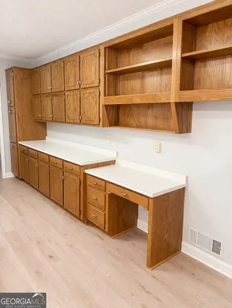a kitchen with stainless steel appliances granite countertop a sink and a stove