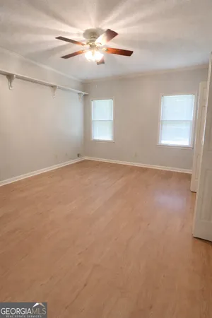 a bedroom with a large bed and a couch