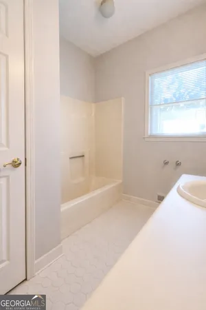 a view of an empty room with a window