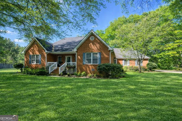 a front view of a house with a yard