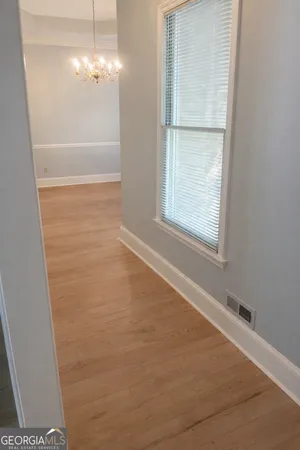 a view of a livingroom with a chandelier fan