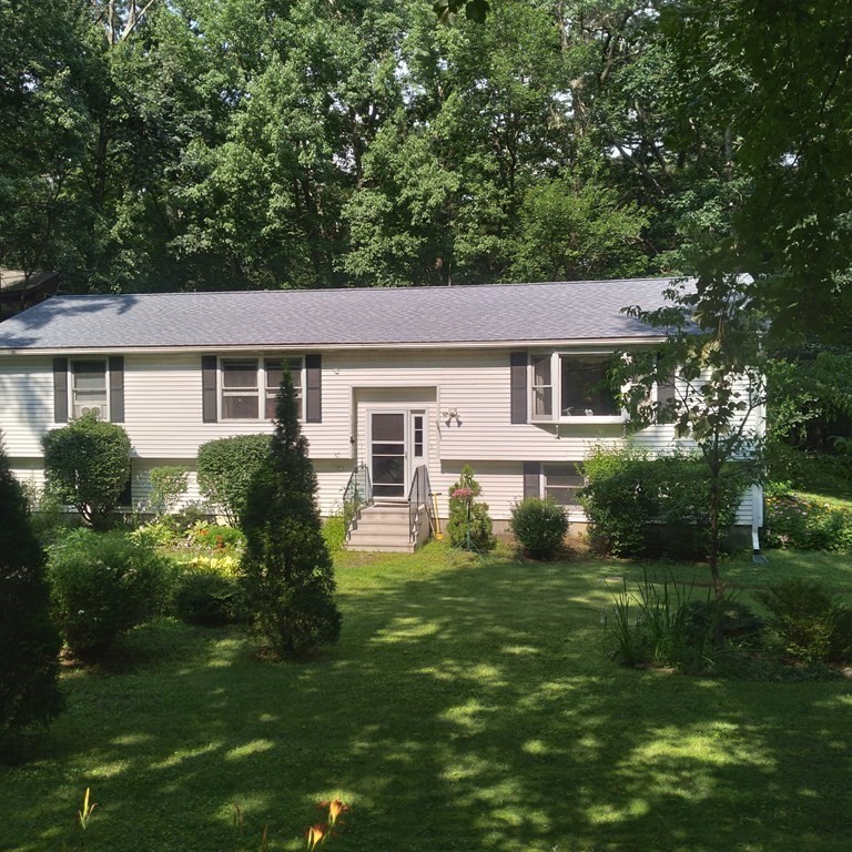 43 Apple Road Brimfield, MA 01010 - Photo 1 of 20 a front view of a house with a yard