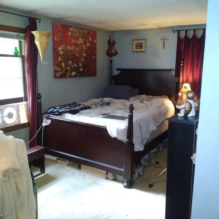 43 Apple Road Brimfield, MA 01010 - Photo 12 of 20 a bed sitting in a bedroom next to a window