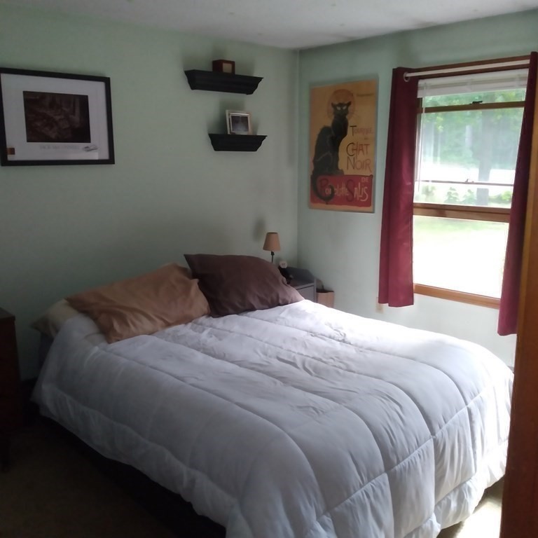 43 Apple Road Brimfield, MA 01010 - Photo 13 of 20 a bedroom with a bed and a painting on the wall