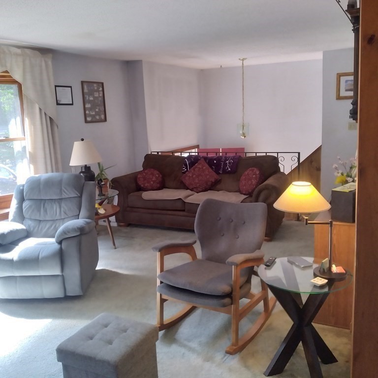 43 Apple Road Brimfield, MA 01010 - Photo 3 of 20 a living room with furniture and a lamp