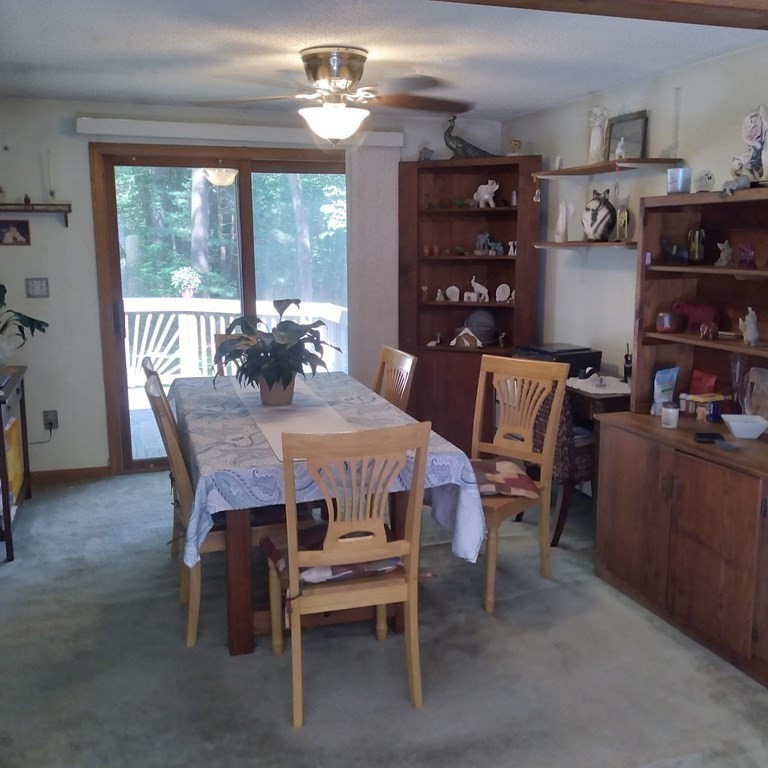 43 Apple Road Brimfield, MA 01010 - Photo 4 of 20 a dining room with a wooden table and chairs