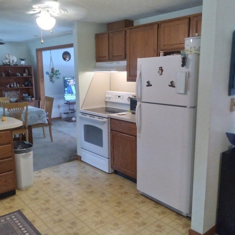 43 Apple Road Brimfield, MA 01010 - Photo 5 of 20 a white refrigerator freezer sitting inside of a kitchen