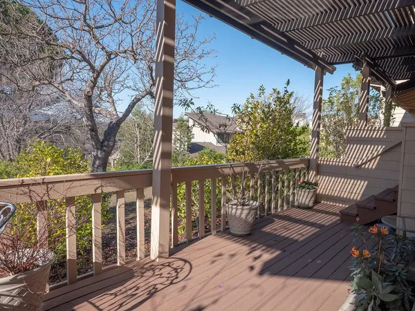 a view of a wooden deck with a bench