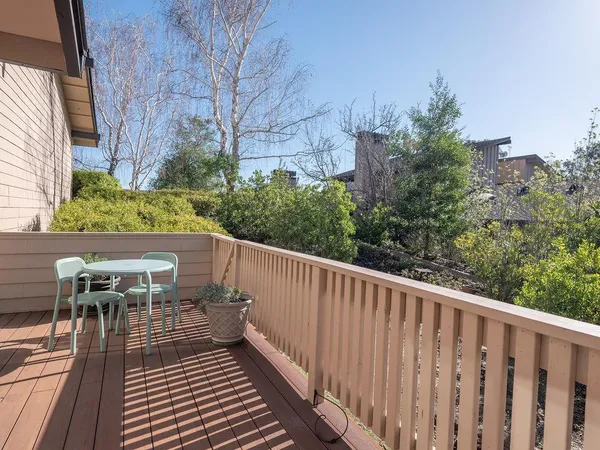 a view of balcony with furniture