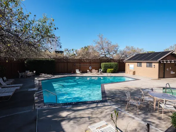 a view of a backyard with sitting area