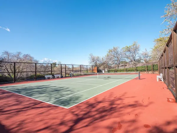 a view of an outdoor space and tennis court