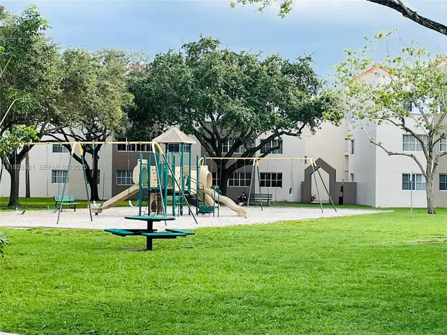 a view of a backyard with a slide