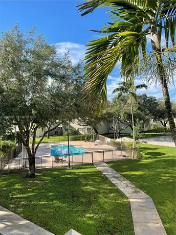 a view of a park with large trees
