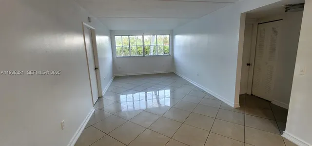 a view of an empty room and window