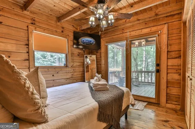 a bed room with a bed and a window