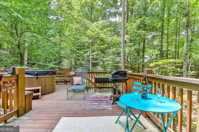 a view of a backyard with plants and a slide